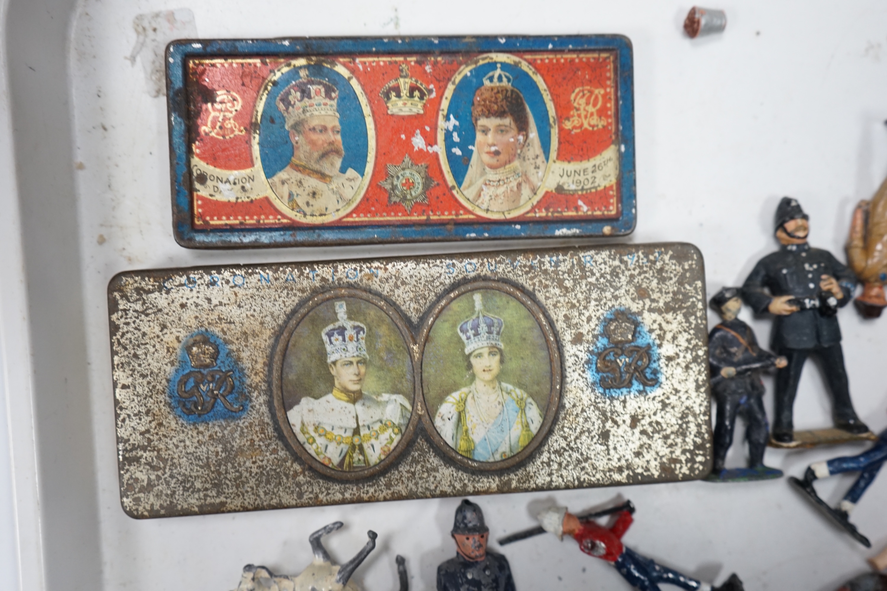 A collection of Britains lead soldiers, mostly British infantry in khaki, including some with gas masks, together with railway station figures by Johillco, etc., plus two Coronation tins, etc. Condition - poor to fair.